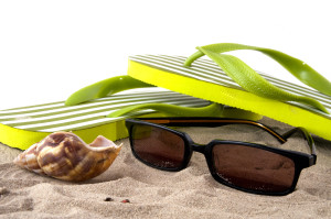 vacation at the beach with travel objects