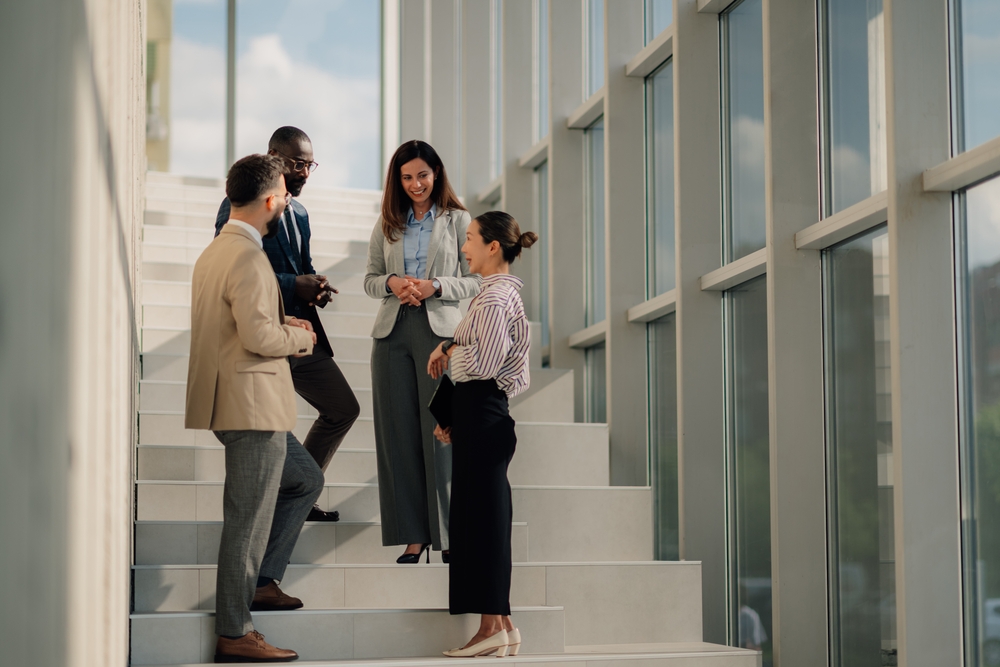 Nexus Communications talent and culture team meeting on a staircase to align on an employee value proposition activation plan for a large organization