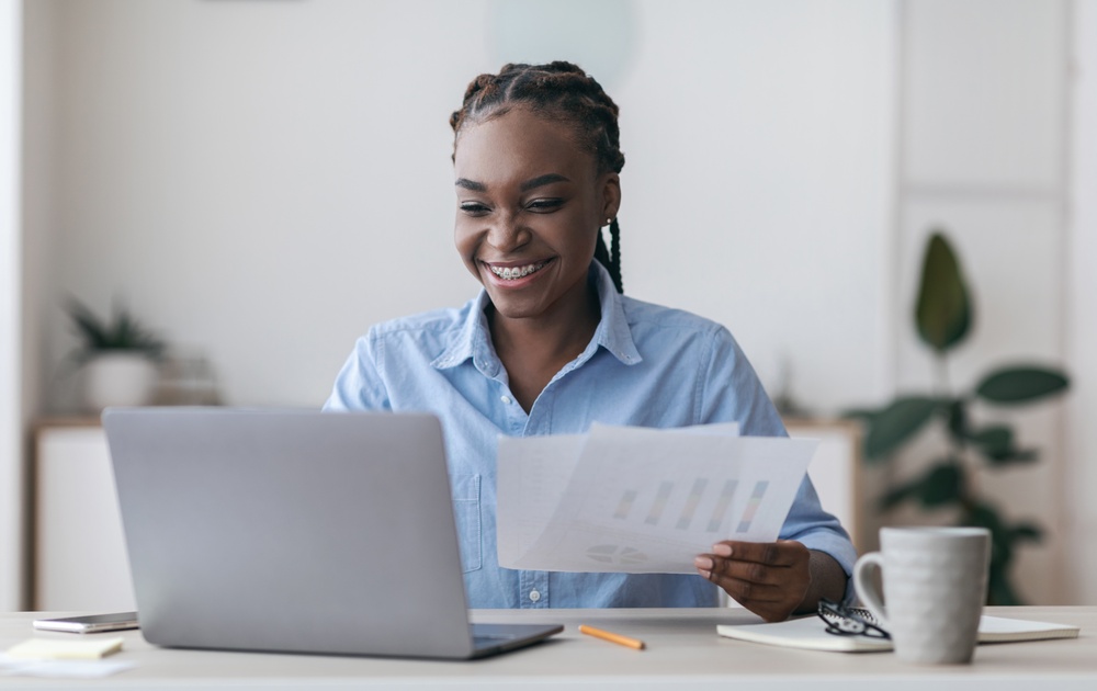 Diverse team of professionals working together in a corporate office, illustrating how to attract millennial talent with collaborative environments.