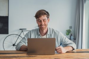 Professionals networking and sharing ideas in an office environment that reflects how to attract millennial talent through employee engagement and innovation.