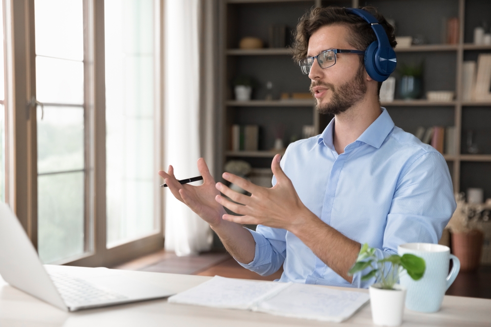 Business professionals collaborating in a modern office while discussing how to attract millennial talent through workplace culture and career growth.