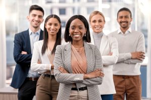 Business professionals collaborating in a modern office while discussing How to Attract Top Talent through effective hiring strategies.