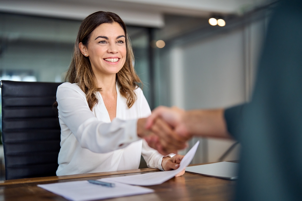 Hiring team interviewing a prospective employee while using digital marketing for recruitment to strengthen candidate outreach.
