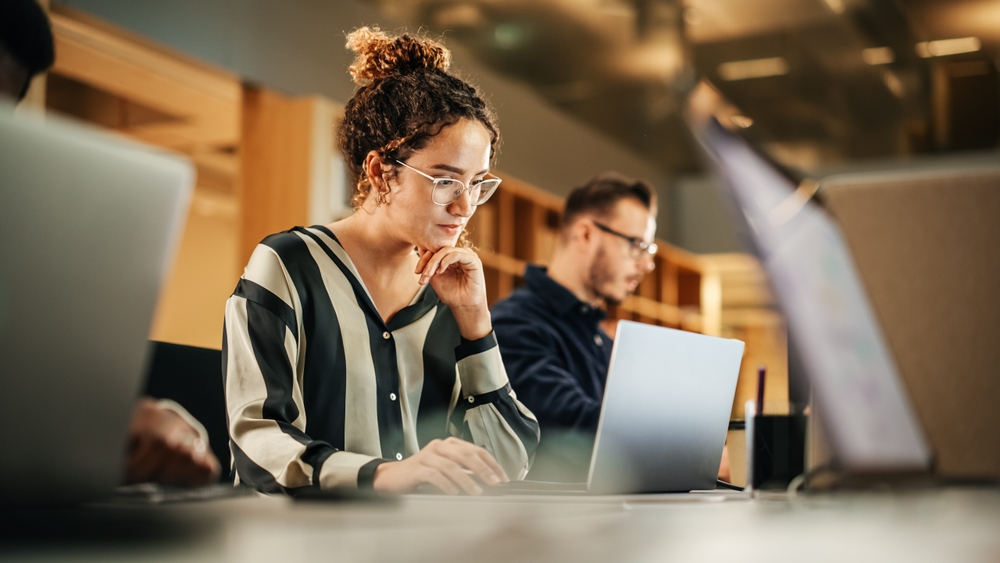 Business professionals collaborating in a strategy meeting focused on employee experience strategy to improve engagement, performance, and workplace culture.
