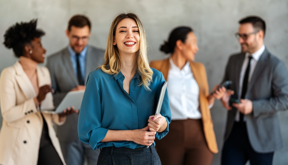 Diverse group of professionals discussing talent solutions during a workplace meeting
